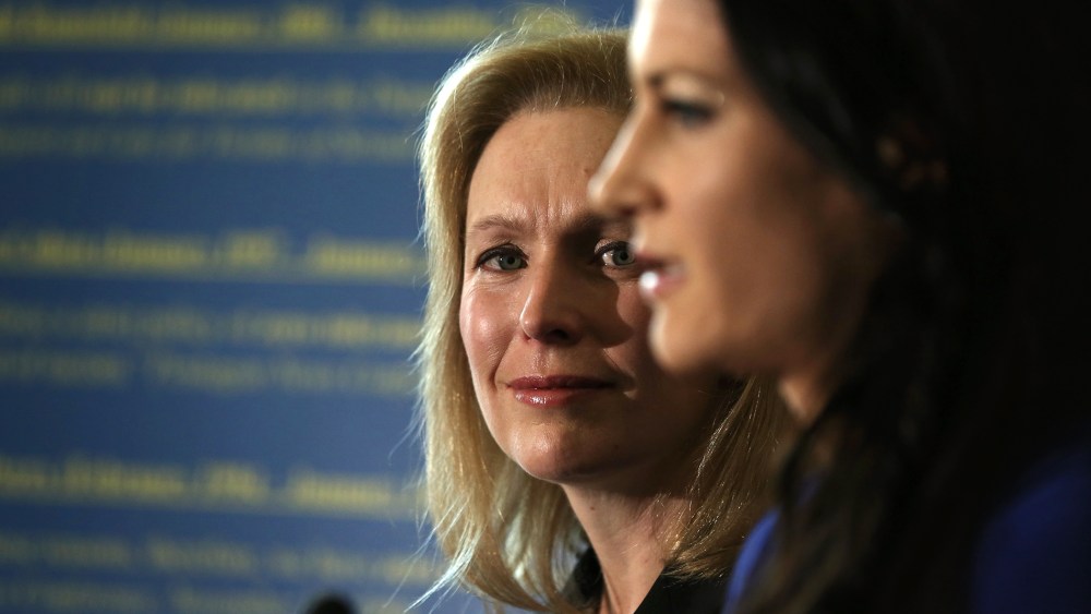 Military sexual assault victim Ariana Klay (R), a former Marine officer assigned to the prestigious Marine Barracks Washington and subsequently served in Iraq, speaks as U.S. Sen. Kirsten Gillibrand (D-NY) (L) listens during a news conference on Nov. 6, 2