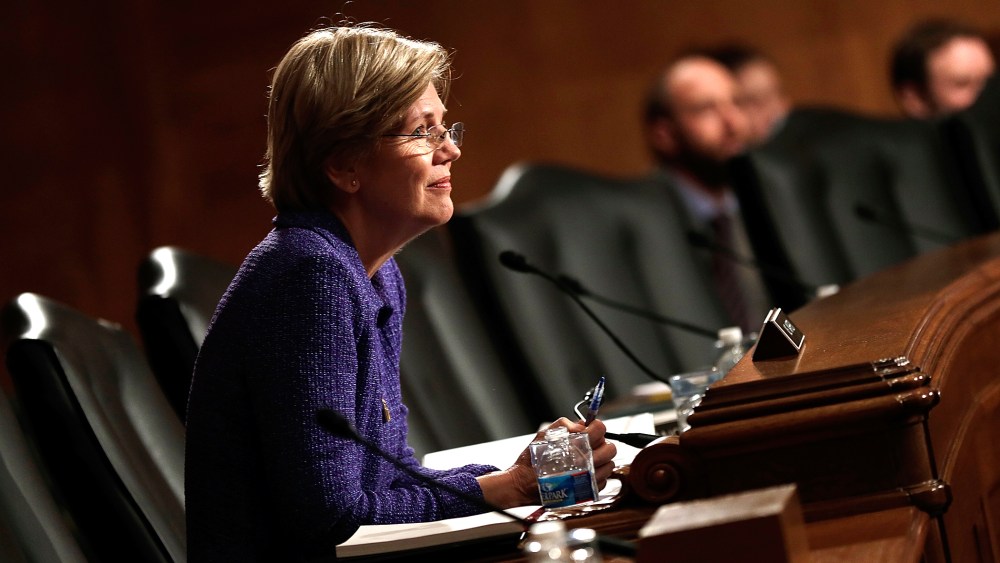 Sen. Elizabeth Warren (D-MA) listens as Consumer Financial Protection Bureau Director Richard Cordray testifies before the Senate Banking, Housing and Urban Affairs Committee, Nov. 12, 2013 in Washington, DC.