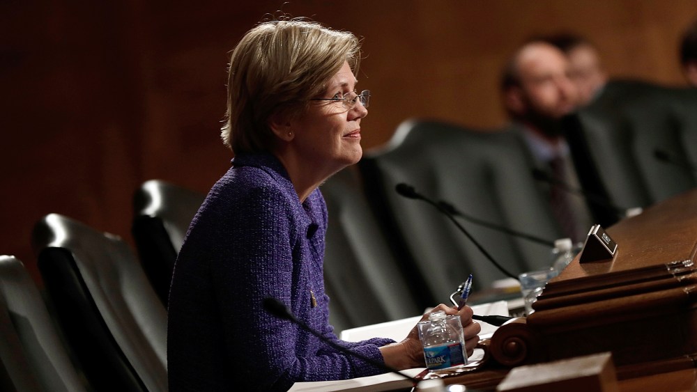 Sen. Elizabeth Warren (D-MA) listens during a hearing, Nov. 12, 2013 in Washington, D.C.