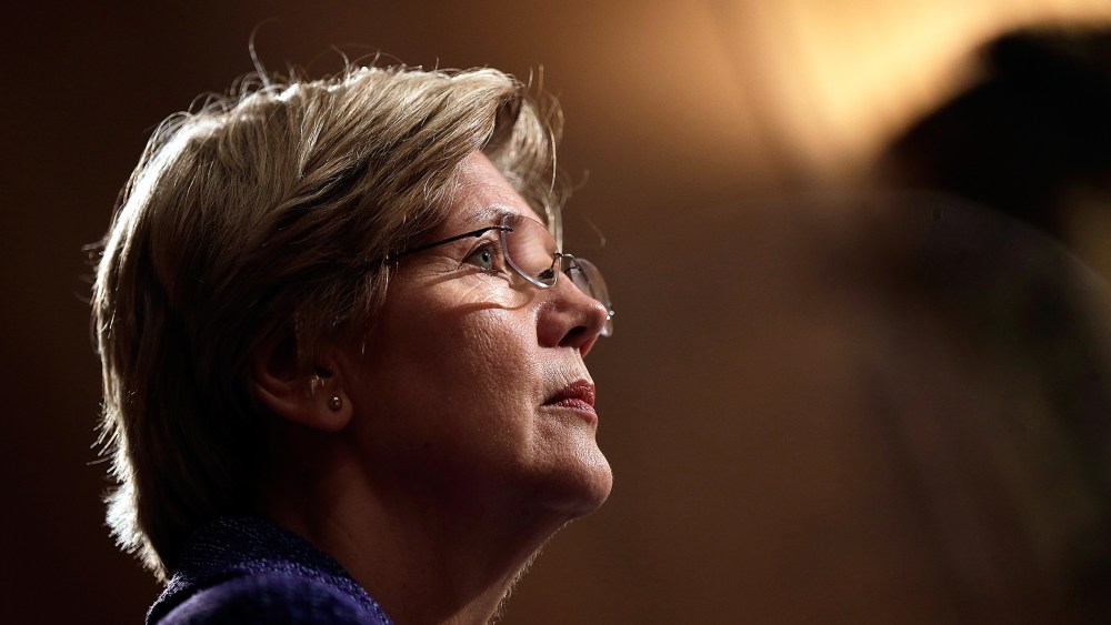 Sen. Elizabeth Warren (D-MA) listens as Consumer Financial Protection Bureau Director Richard Cordray testifies before the Senate Banking, Housing and Urban Affairs Committee on Nov. 12, 2013 in Washington, DC.