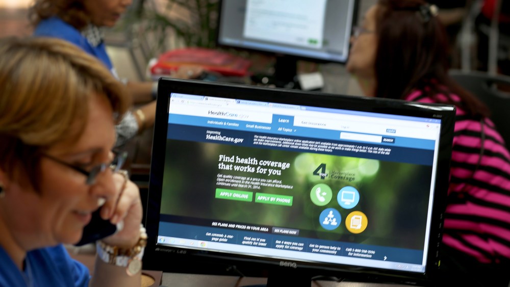 Insurance agent Mercy Cabrera provides information about an insurance policy under the Affordable Care Act in Hialeah, Florida, Nov. 14, 2013.