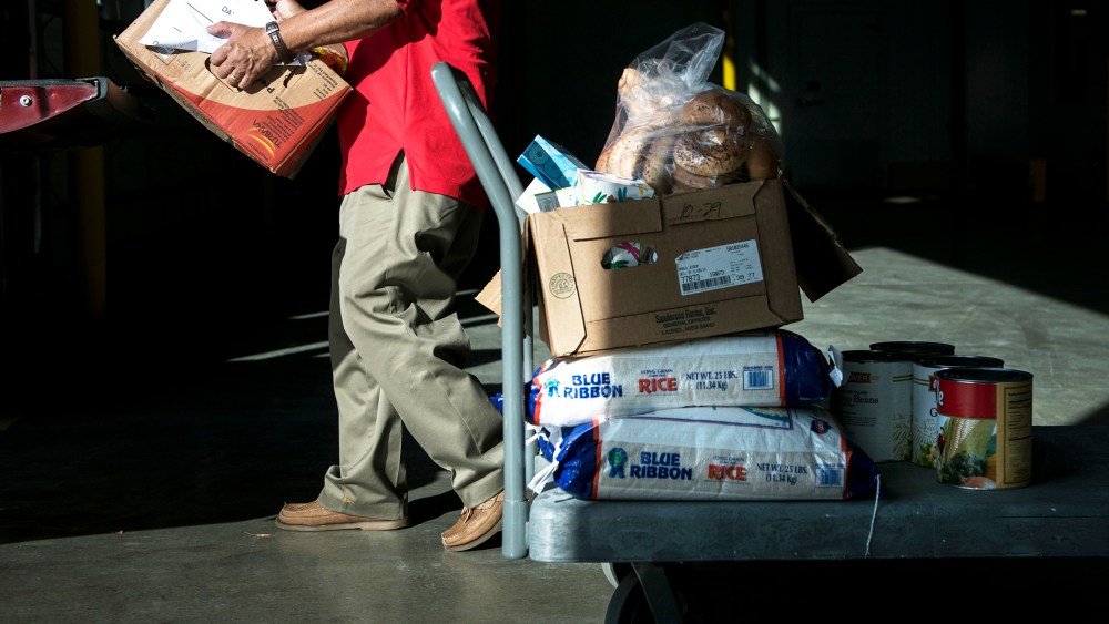 A volunteer loads food at the Capital Area Food Bank, Nov. 14, 2013 in Washington, DC.