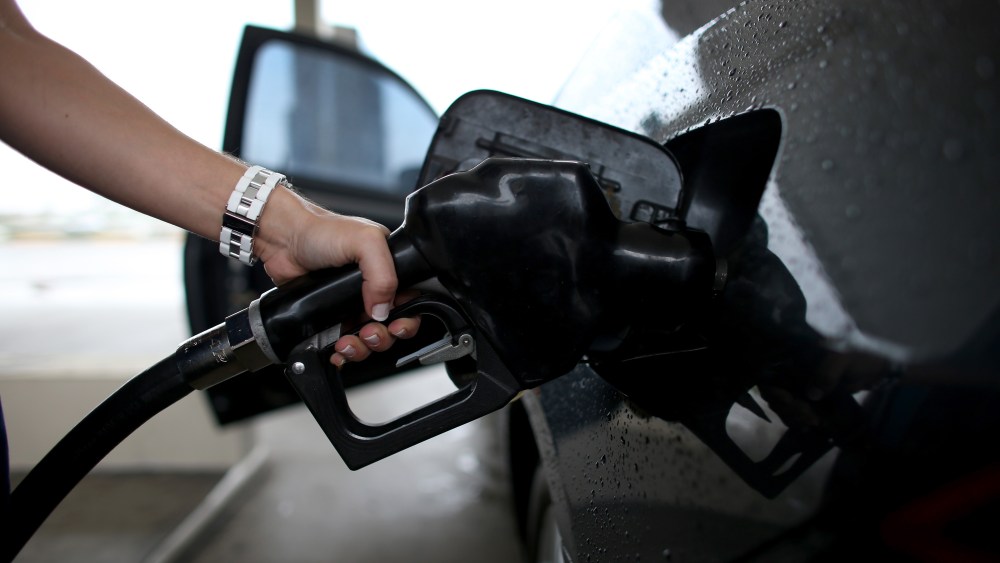A woman pumps gas into her car on Nov, 15, 2013 in Pembroke Pines, Fla. (Joe Raedle/Getty)