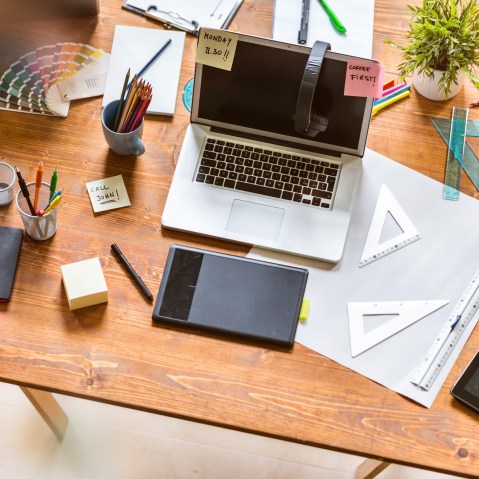 Image: Messy desk of young startup coworking business