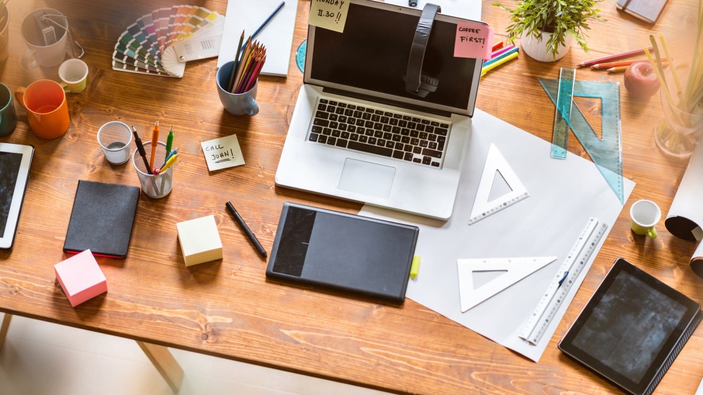 Image: Messy desk of young startup coworking business