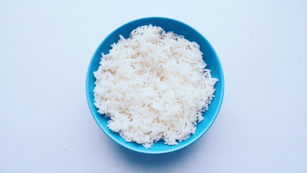 Directly Above Shot Of Rice In Bowl Over White Background
