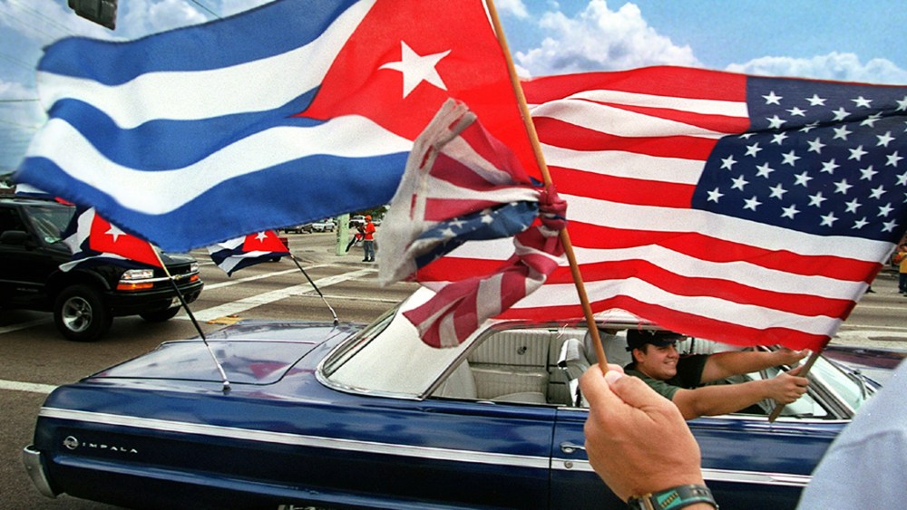 Protestors wave Cuban and American flags in the Little Havana neighborhood of Miami, Fla. on April 25, 2000.
