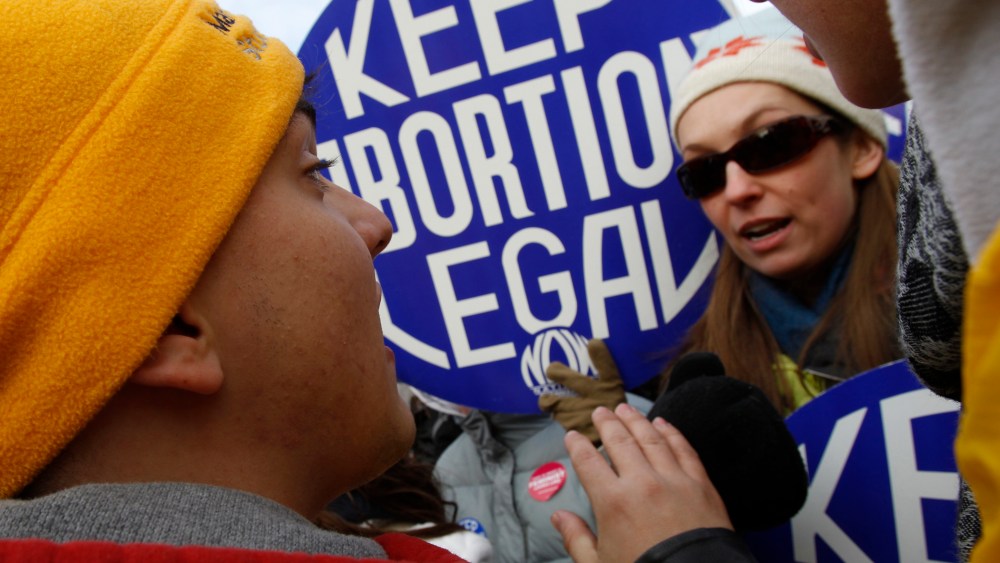 Pro-life and pro-choice supporters square off in an argument during a demonstration marking the anniversary of the Supreme Court's 1973 Roe v. Wade abortion decision in Washington, January 24, 2011.