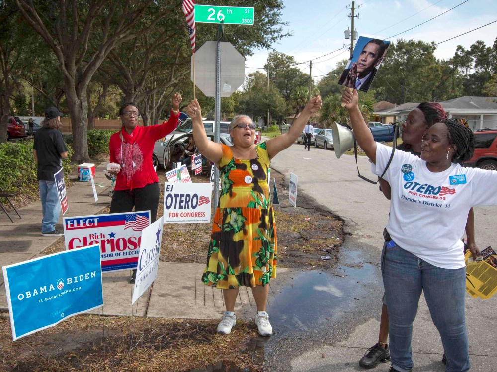 Supporter of President Barack Obama rally outside a polling station during the U.S. presidential election in Tampa, Florida November 6, 2012. (Photo by Scott Audette/Reuters)