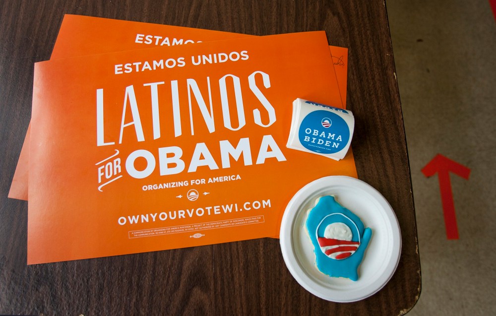 Placards and campaign stickers sit on a table at the Latino regional headquarters for the Obama campaign during election day of the U.S. presidential election in Milwaukee, Wisconsin November 6, 2012. (Photo by REUTERS/Sara Stathas)