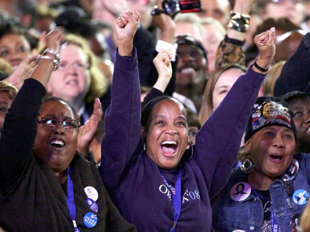 U.S. President Barack Obama supporters cheer while watching the returns prior to his election night rally in Chicago, November 6, 2012.  (Photo by REUTERS/John Gress)