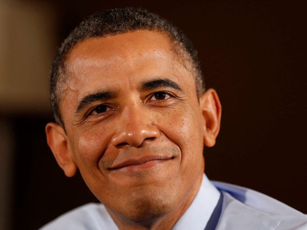 U.S. President Barack Obama pauses after he speaks while visiting members of a middle class family in their home to discuss his Administration's push to cut taxes for 98% of Americans in Falls Church in Fairfax County, Virginia. (Photo by Larry Downing...