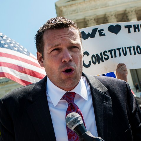Kansas Secretary of State Kris W. Kobach speaks to the media outside of the Supreme Court, April 25, 2012. (Photo by Pete Marovich/ZUMA)