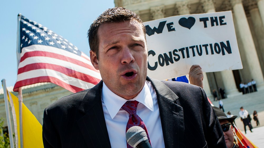 Kansas Secretary of State Kris W. Kobach speaks to the media outside of the Supreme Court, April 25, 2012. (Photo by Pete Marovich/ZUMA)