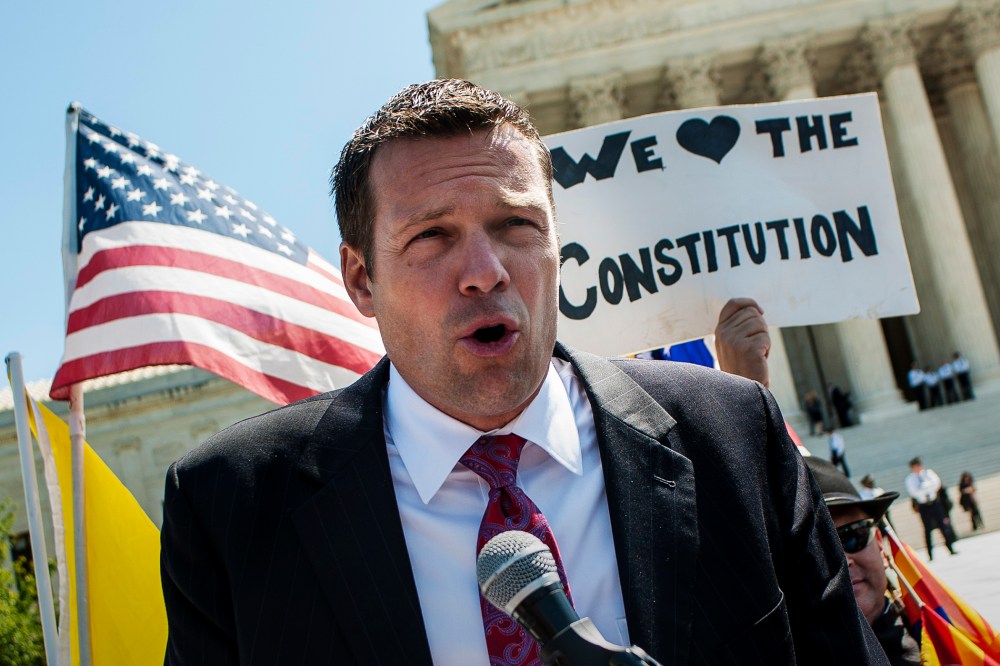 Kansas Secretary of State Kris W. Kobach speaks to the media outside of the Supreme Court, April 25, 2012. (Photo by Pete Marovich/ZUMA)