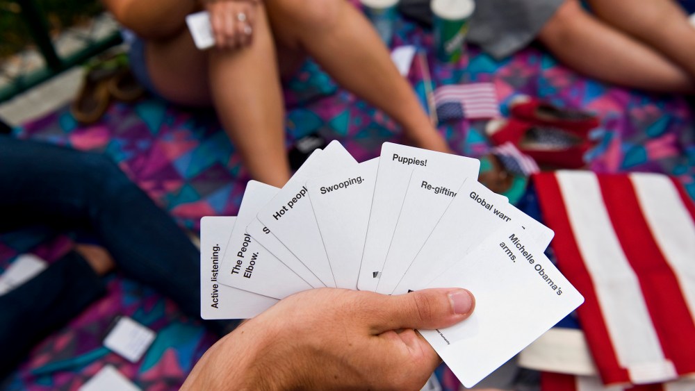 Students play Cards Against Humanity at an event in Denver, Colo. (Photo by Brian Cahn/Zuma)