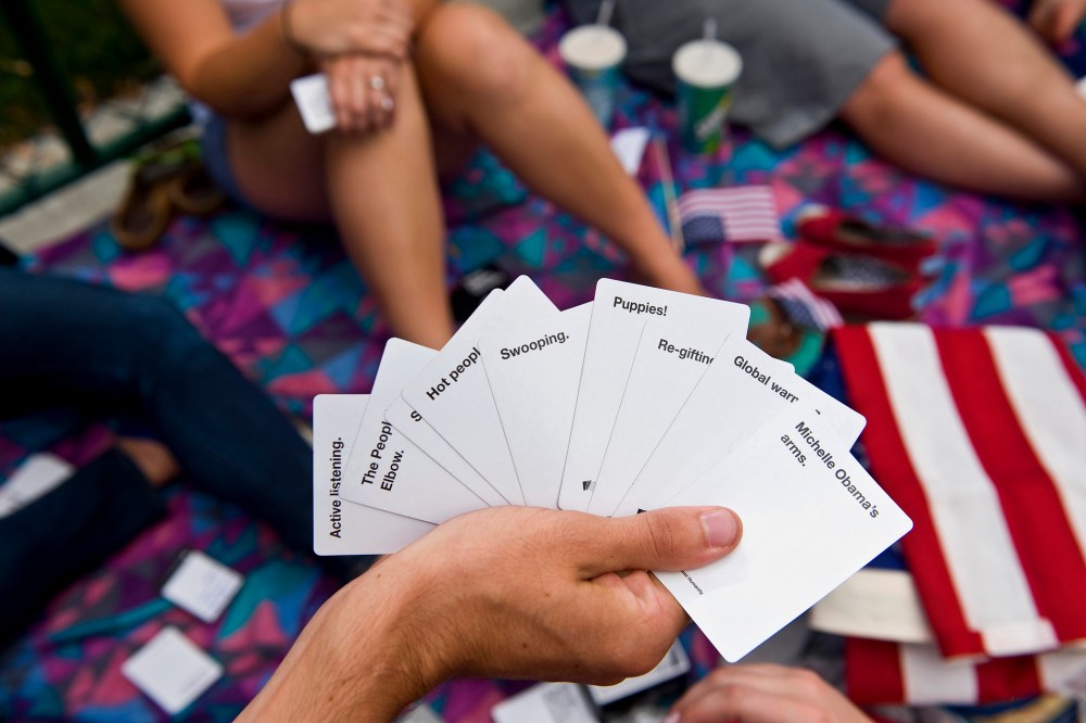 Students play Cards Against Humanity at an event in Denver, Colo. (Photo by Brian Cahn/Zuma)