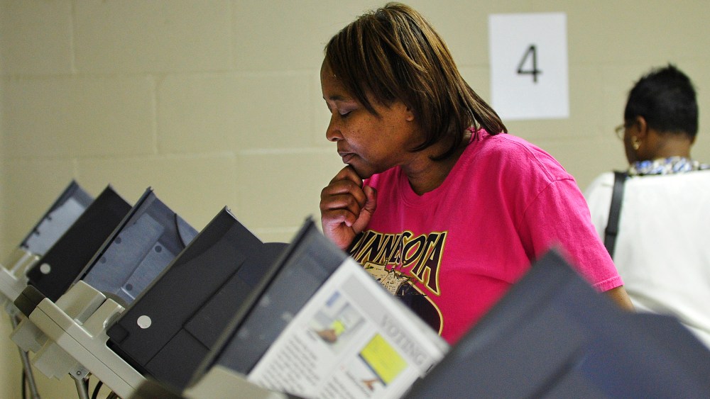 A women votes at the Henry Brigham Community Center in Augusta, Ga. on Oct. 27, 2012. (Photo by Jon-Michael Sullivan/Augusta Chronicle/ZUMA Press)