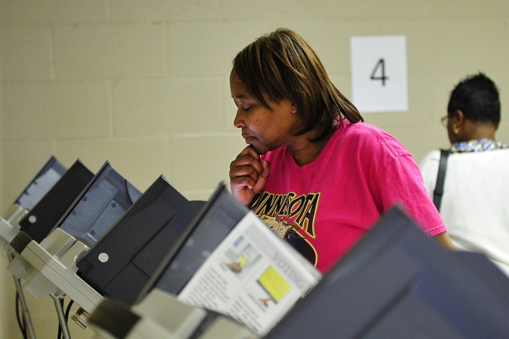 A women votes at the Henry Brigham Community Center in Augusta, Ga. on Oct. 27, 2012. (Photo by Jon-Michael Sullivan/Augusta Chronicle/ZUMA Press)