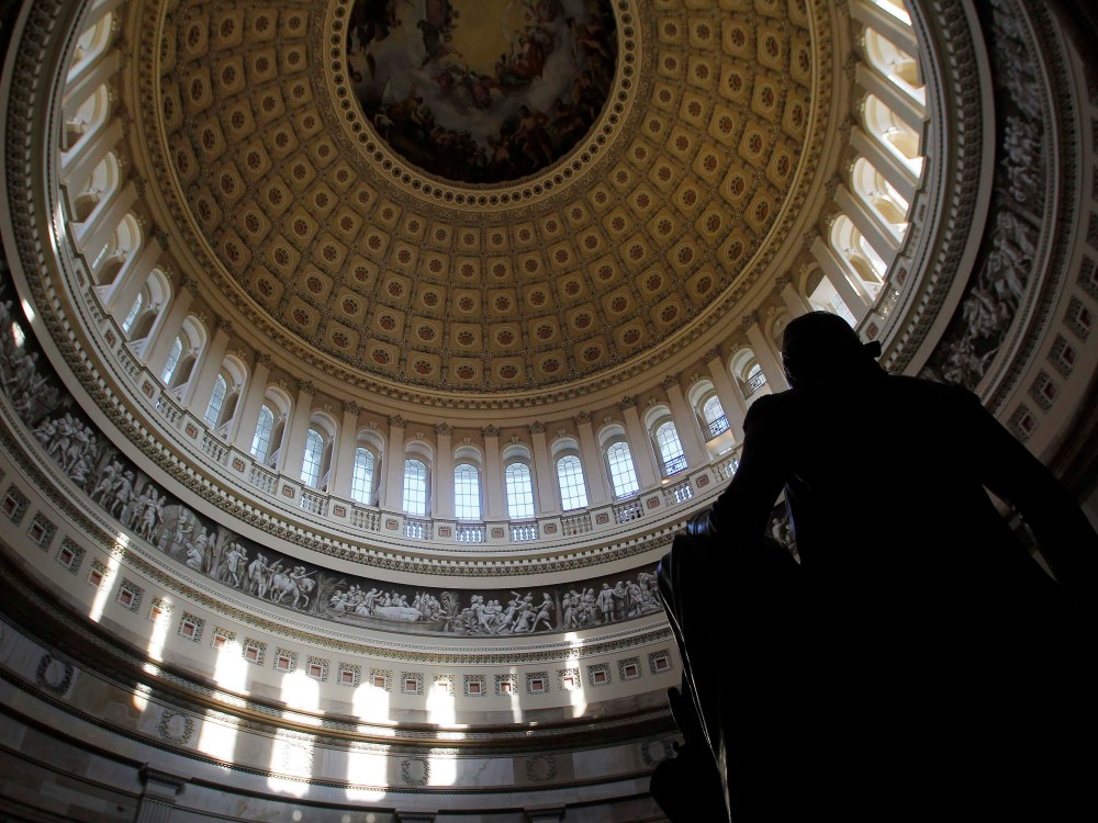 A statue of the United States first President, George Washington, is seen under the Capitol dome in Washington January 2, 2013. The new 113th U.S. Congress convenes tomorrow on January 3, set to take a fresh crack at a number of issues, such as gun...