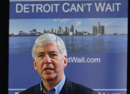 Michigan Governor Rick Snyder talks about the city of Detroit being in a financial emergency state during a meeting with an invited audience at Wayne State University in Detroit, Michigan March 1, 2013. (REUTERS/ Rebecca Cook)