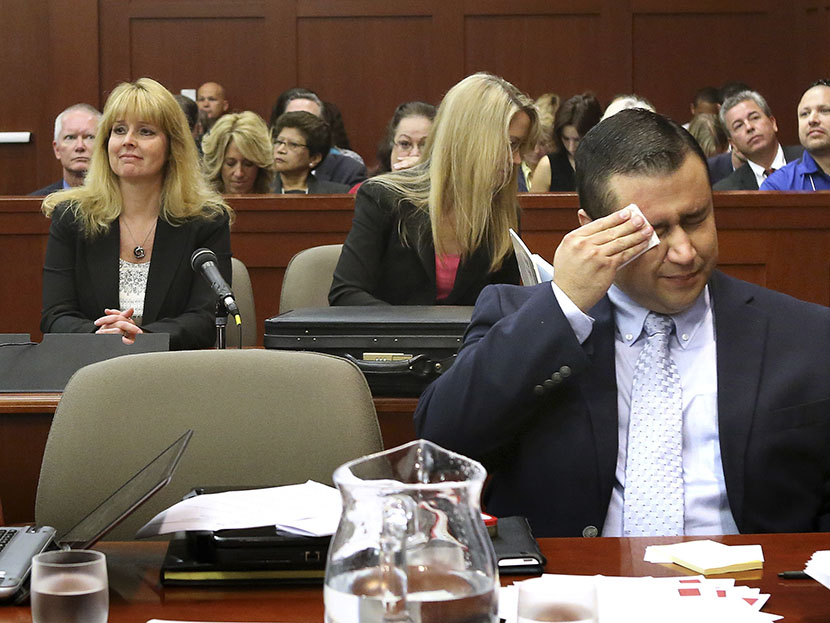 George Zimmerman wipes his face after arriving in the courtroom in Sanford, Florida July 12, 2013. (Photo by Joe Burbank/Pool/Reuters)