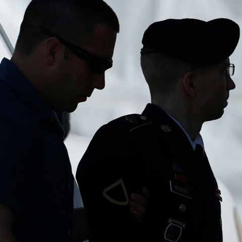 U.S. Army Private First Class Bradley Manning (R) enters the courthouse at Fort Meade, Maryland, July 30, 2013. (Photo by Gary Cameron/Reuters)