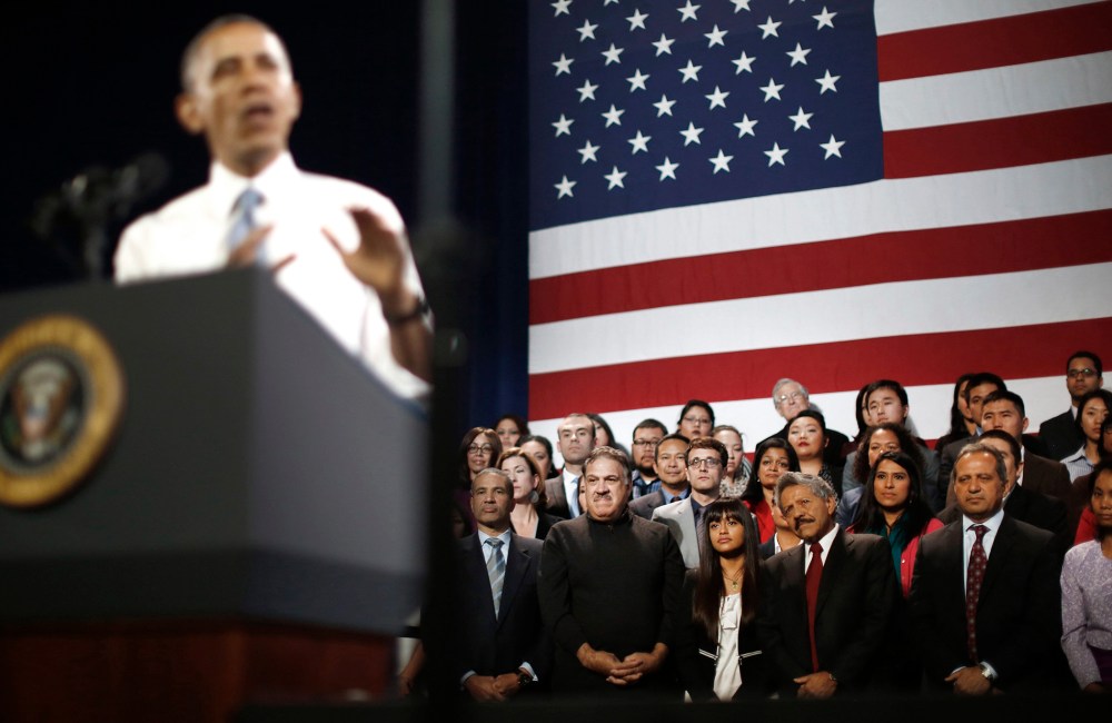 Audience members listen to President Barack Obama as he speaks at an event on immigration reform in San Francsico, Nov. 25, 2013.