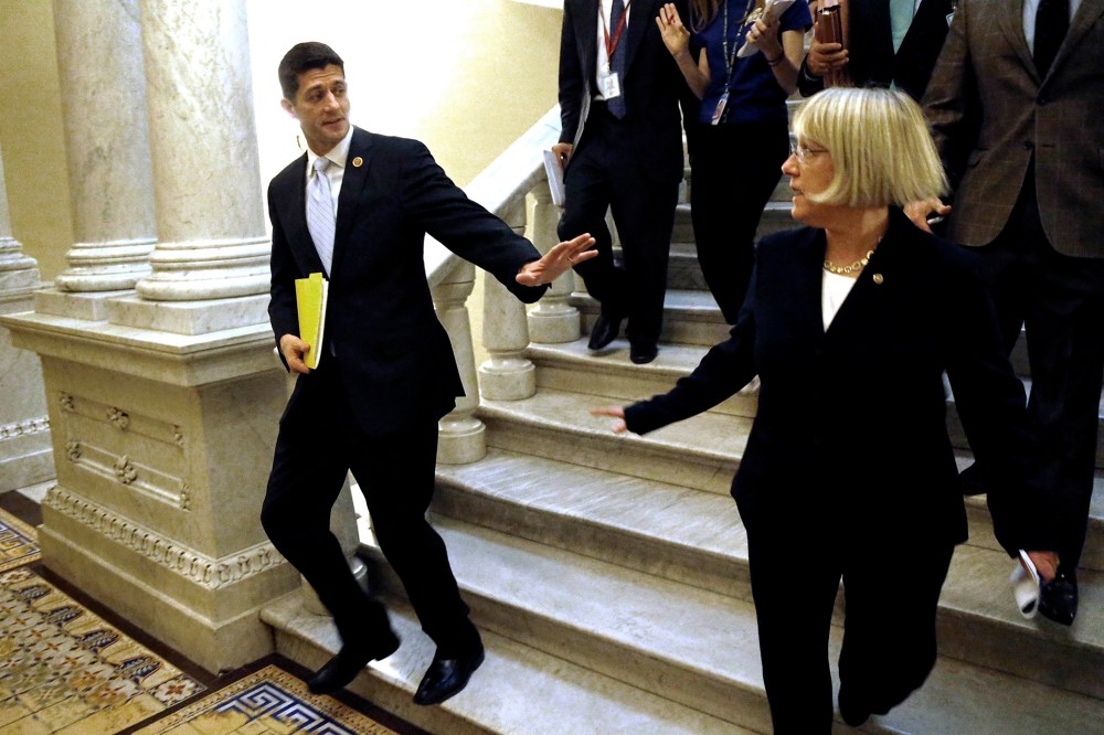 Senators Patty Murray (D-WA) and Representative Paul Ryan (R-WI) depart after a news conference to introduce The Bipartisan Budget Act of 2013 at the U.S. Capitol in Dec. 10, 2013.