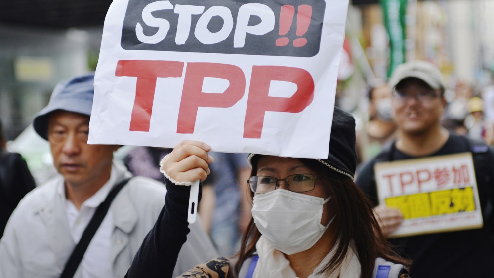 A woman protests against the Trans-Pacific Strategic Economic Partnership Agreement, or TPP, during a demonstration at Ginza, Chuo, Tokyo, Japan on May 25, 2013. (Photo by Koichiro Suzuki/AFLO/ZUMA)