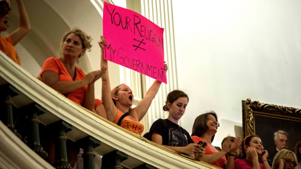 Demonstrators protest at State Capitol building in Austin, Texas, on July 12, 2013.