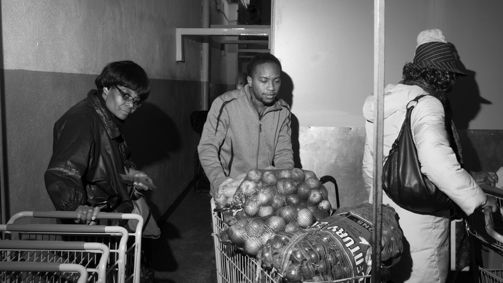 Paul Jones brings bags of onions to restock bins at the Bed-Stuy Campaign Against Hunger food pantry, in Brooklyn, New York.