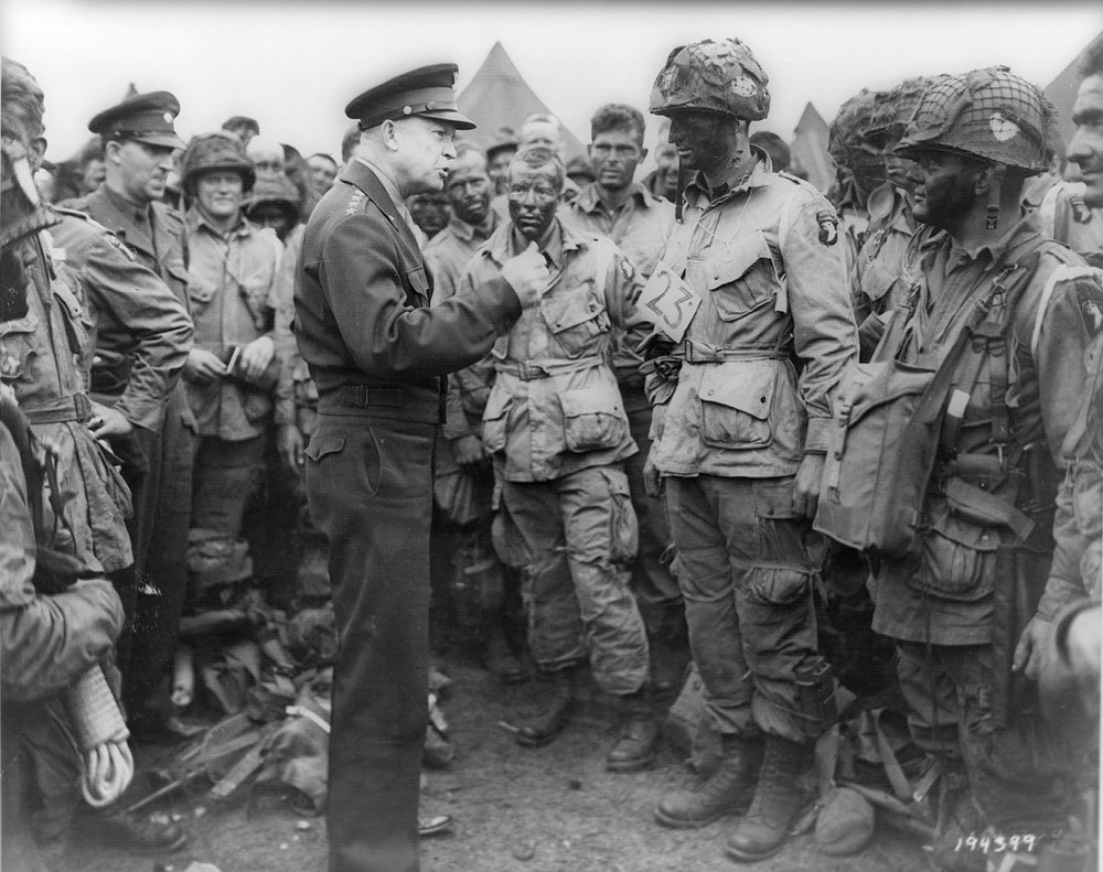 Allied forces Supreme Commander General Dwight D. Eisenhower speaks with U.S. Army paratroopers of Easy Company, 502nd Parachute Infantry Regiment (Strike) of the 101st Airborne Division, at Greenham Common Airfield in England June 5, 1944.