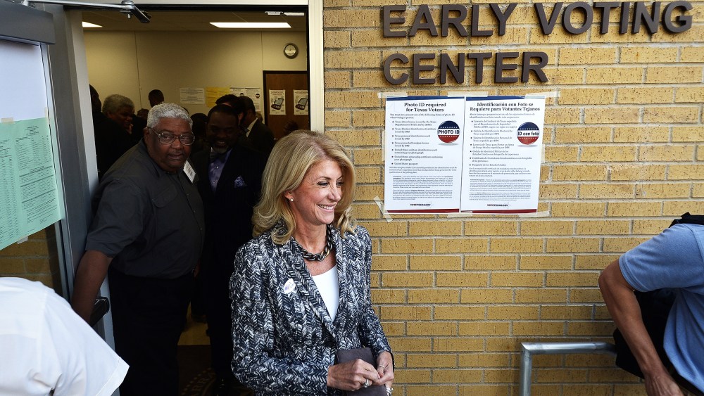 Wendy Davis exits the Early Voting Center after casting her vote on the first day of voting at the Charles Griffin Sub-Courthouse in Fort Worth, Texas on Oct. 20, 2014.