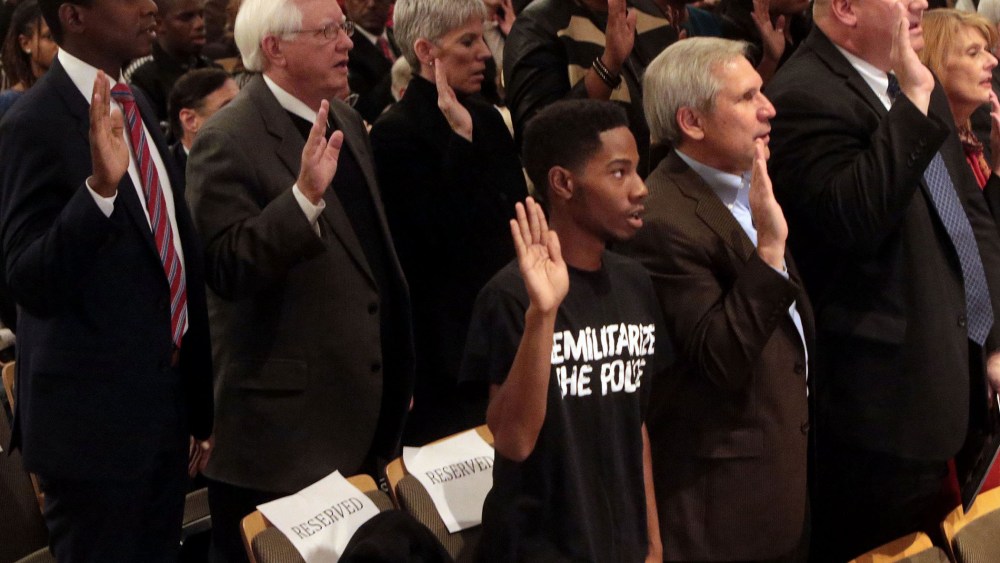 Members of the Ferguson Commission are sworn in at the Missouri History Museum on Nov. 18, 2014.