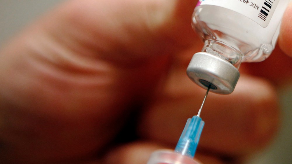 A nurse prepares an injection of the influenza vaccine at Massachusetts General Hospital in Boston, Massachusetts in this Jan. 10, 2013 file photo. (Photo by Brian Snyder/Reuters)