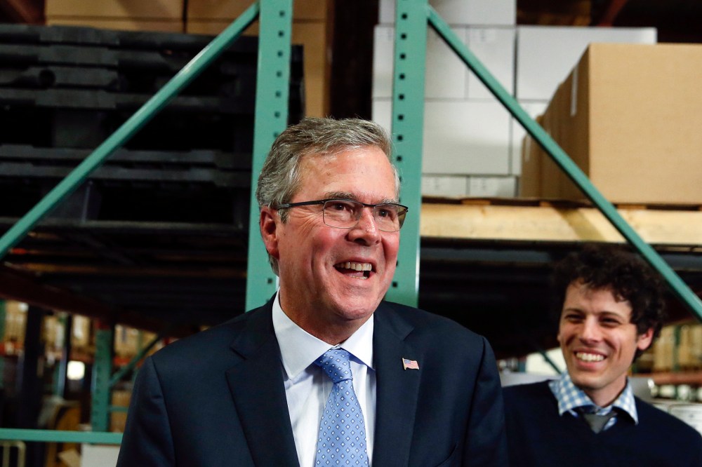 Former Florida Governor Jeb Bush smiles while talking to the media after visiting Integra Biosciences during a campaign stop in Hudson, New Hampshire on March 13, 2015. (Photo by Shannon Stapleton/Reuters)