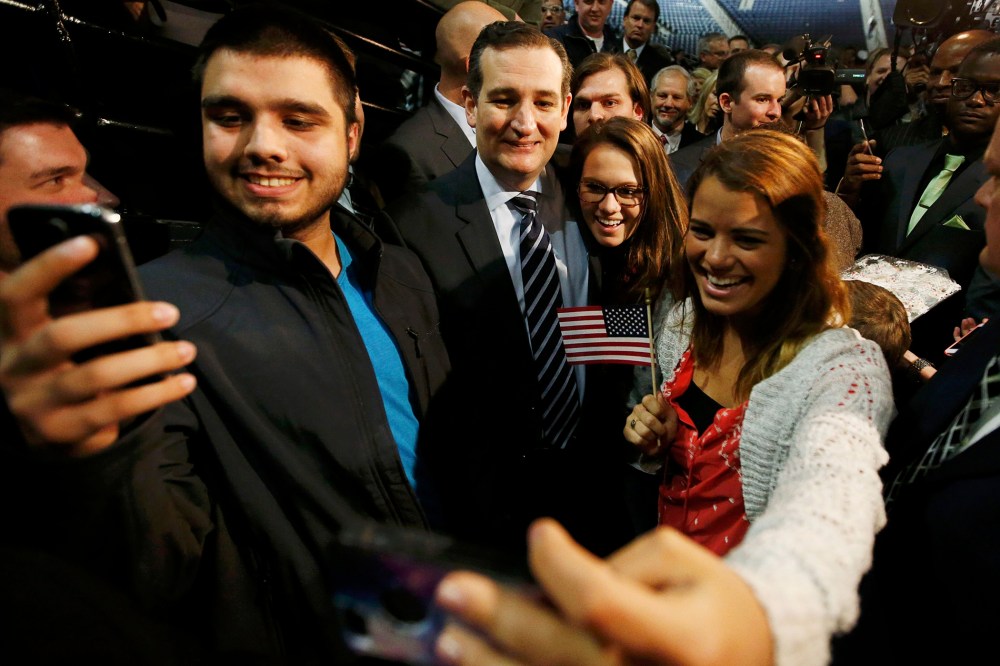 Sen. Ted Cruz (R-TX) poses for pictures with students shooting "selfies" after confirming his candidacy for the 2016 U.S. presidential election race during a speech at Liberty College in Lynchburg, Va. on March 23, 2015. (Photo by Chris Keane/Reuters)