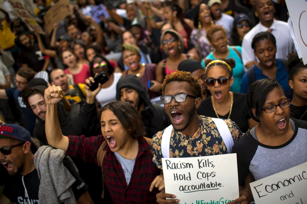 Demonstrators march in Baltimore, Md. on April 29, 2015. (Photo by Eric Thayer/Reuters)