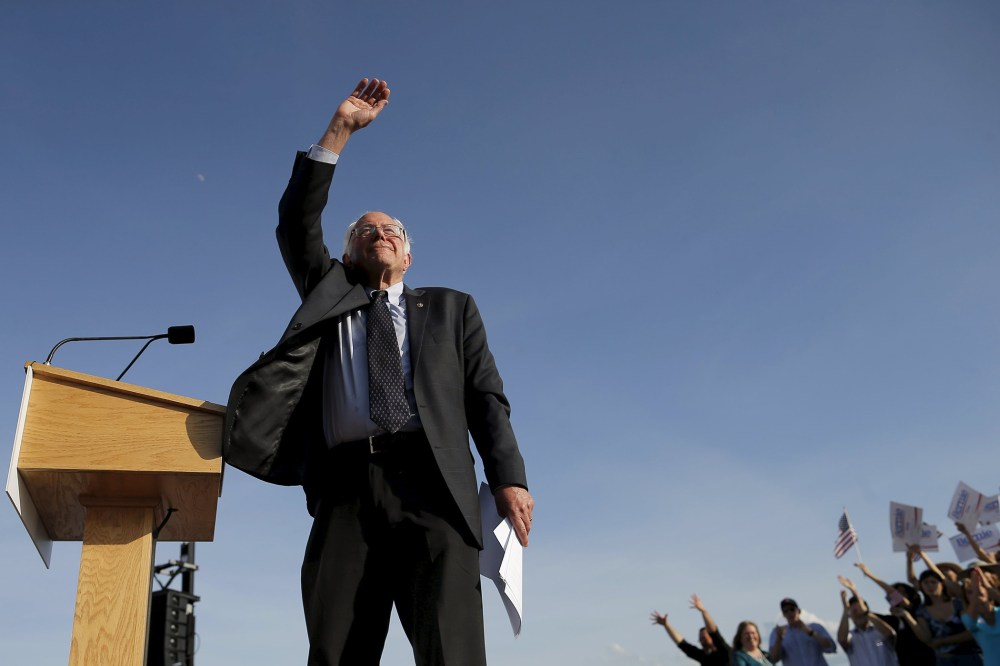 Democratic presidential candidate and U.S. Senator Bernie Sanders waves to the crowd of supporters after speaking at a campaign kickoff rally in Burlington, Vt., May 26, 2015. (Photo by Brain Snyder/Reuters)