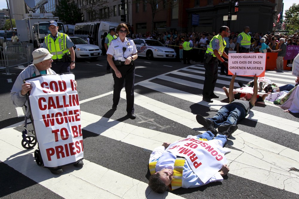 Protesters block a street outside Saint Matthew's Cathedral in Washington during Pope Francis' prayer meeting with U.S. bishops, Sept. 23, 2015. (Photo by Yuri Gripas/Reuters)