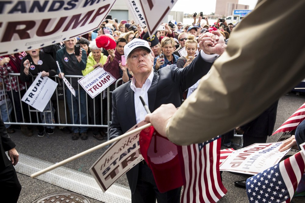 Republican presidential candidate Donald Trump shakes hands with supporters during a campaign rally at the USS Wisconsin battleship in Norfolk, Va., Oct. 31, 2015. (Photo by Joshua Roberts/Reuters)