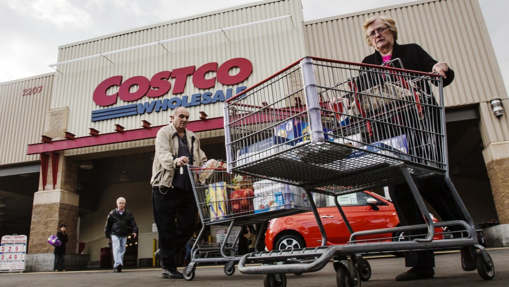 Shoppers leave a Costco store in Alhambra, Calif. on March 3, 2015. (Photo by Ringo Chiu/ZUMA)
