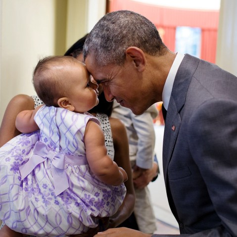 President Barack Obama greets nine-month-old Josephine Gronniger outside the Oval Office of the White House, July 17, 2015 in Washington, DC. (Photo by Pete Souza/Official White House Photo/Planet Pix/ZUMA)