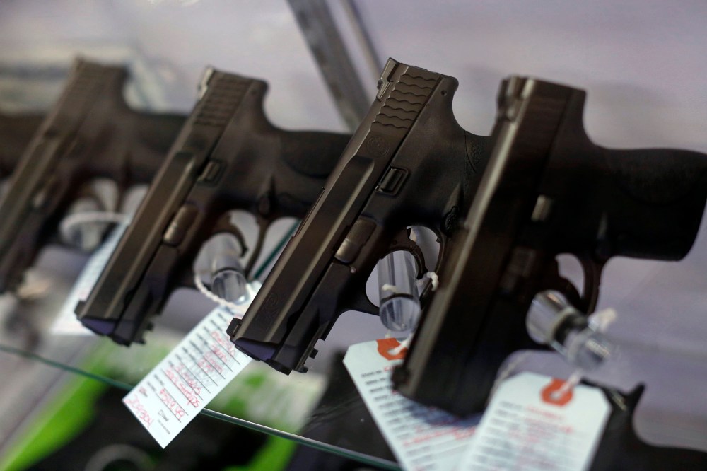 Handguns are seen for sale in a display case in Bridgeton, Mo. (Photo by Jim Young/Reuters)