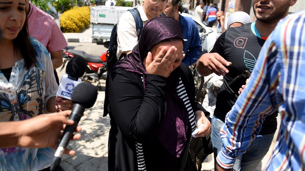 Media reporters surround relatives of those on the missing plane on May 19, 2016 in Cairo, Egypt. (Photo by Zhao Dingzhe/Xinhua/Zuma)