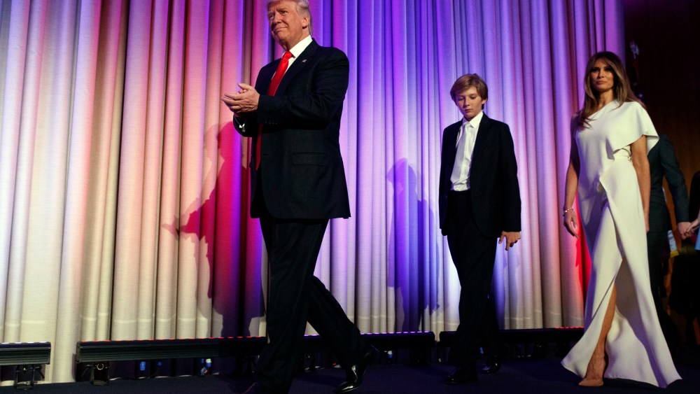 President-elect Donald Trump, arrives with his son Barron, center, and wife Melania, to speak to an election night rally, Nov. 9, 2016, in N.Y. (Photo by Evan Vucci/AP)