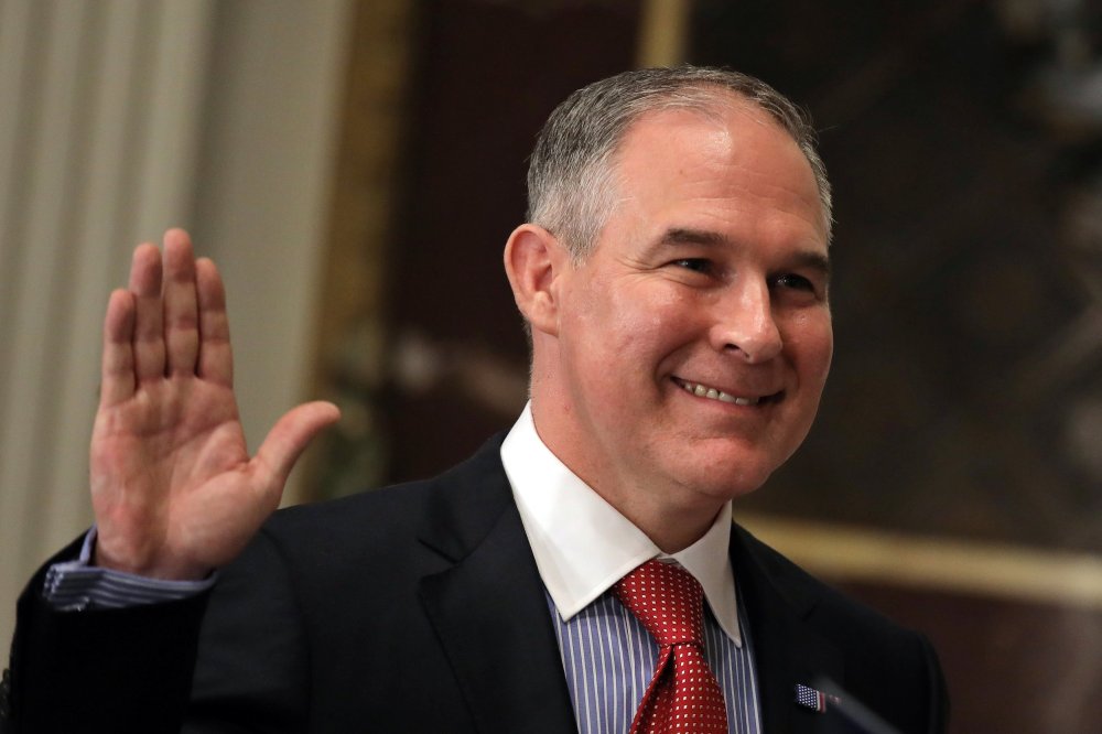 Image: Director of Environmental Protection Agency Scott Pruitt is sworn in by Justice Samuel Alito (not pictured) at the Executive Office in Washington