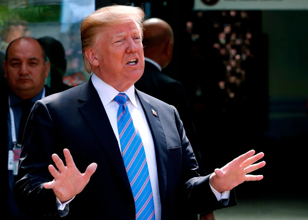 Image: U.S. President Donald Trump departs from the G7 summit in the Charlevoix city of La Malbaie