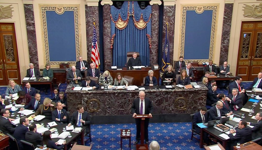 Attorney Ken Starr speaks as U.S. President Donald Trump's legal team resumes its presentation of opening arguments in Trump's Senate impeachment trial in this frame grab from video shot in the U.S. Senate Chamber at the U.S. Capitol in Washington, U.S.,